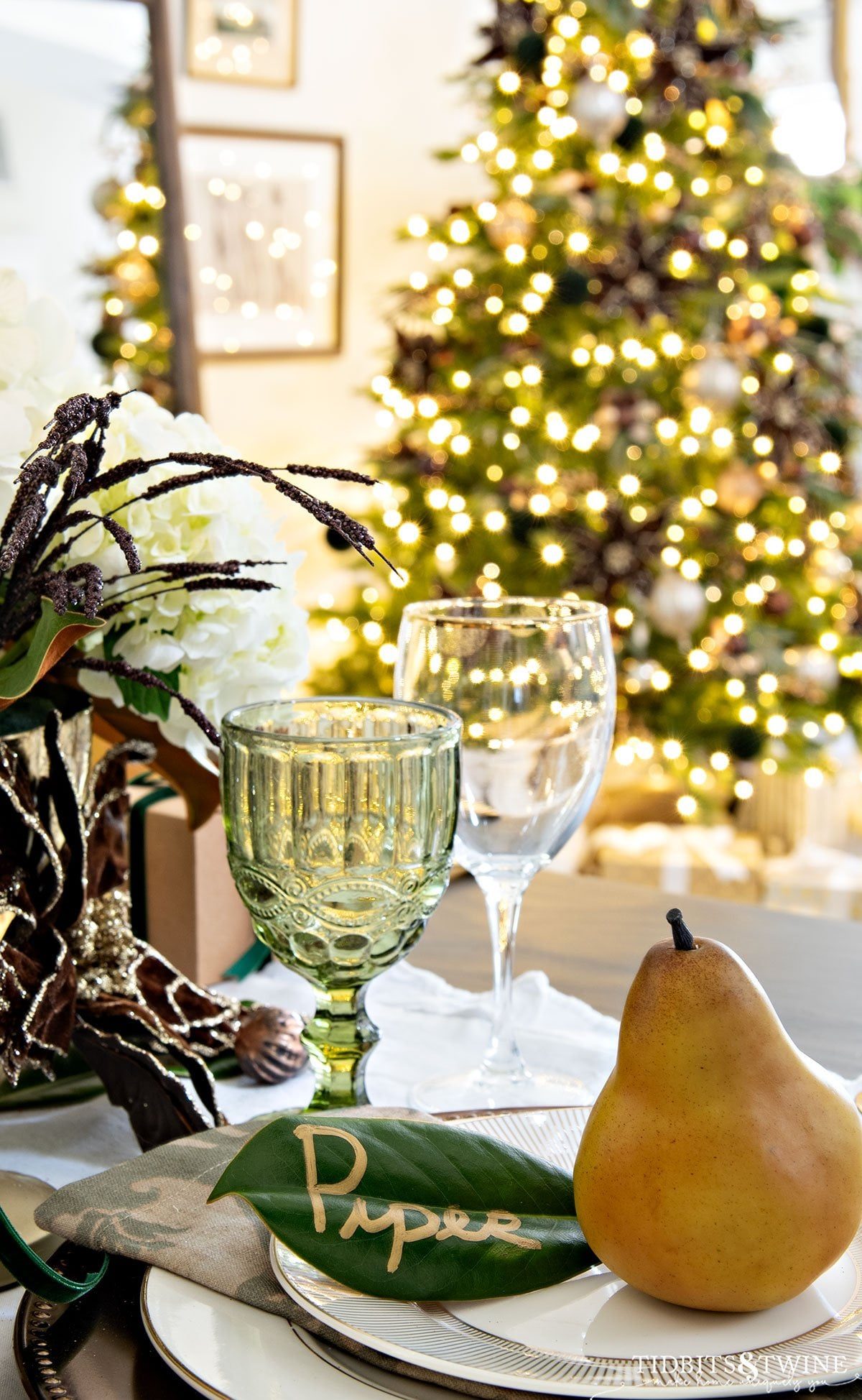 Elegant Table Setting with Green Glassware and Magnolia Place Card Elegant Table Setting with Green Glassware and Magnolia Place Card — Aesthetic Christmas Decor
