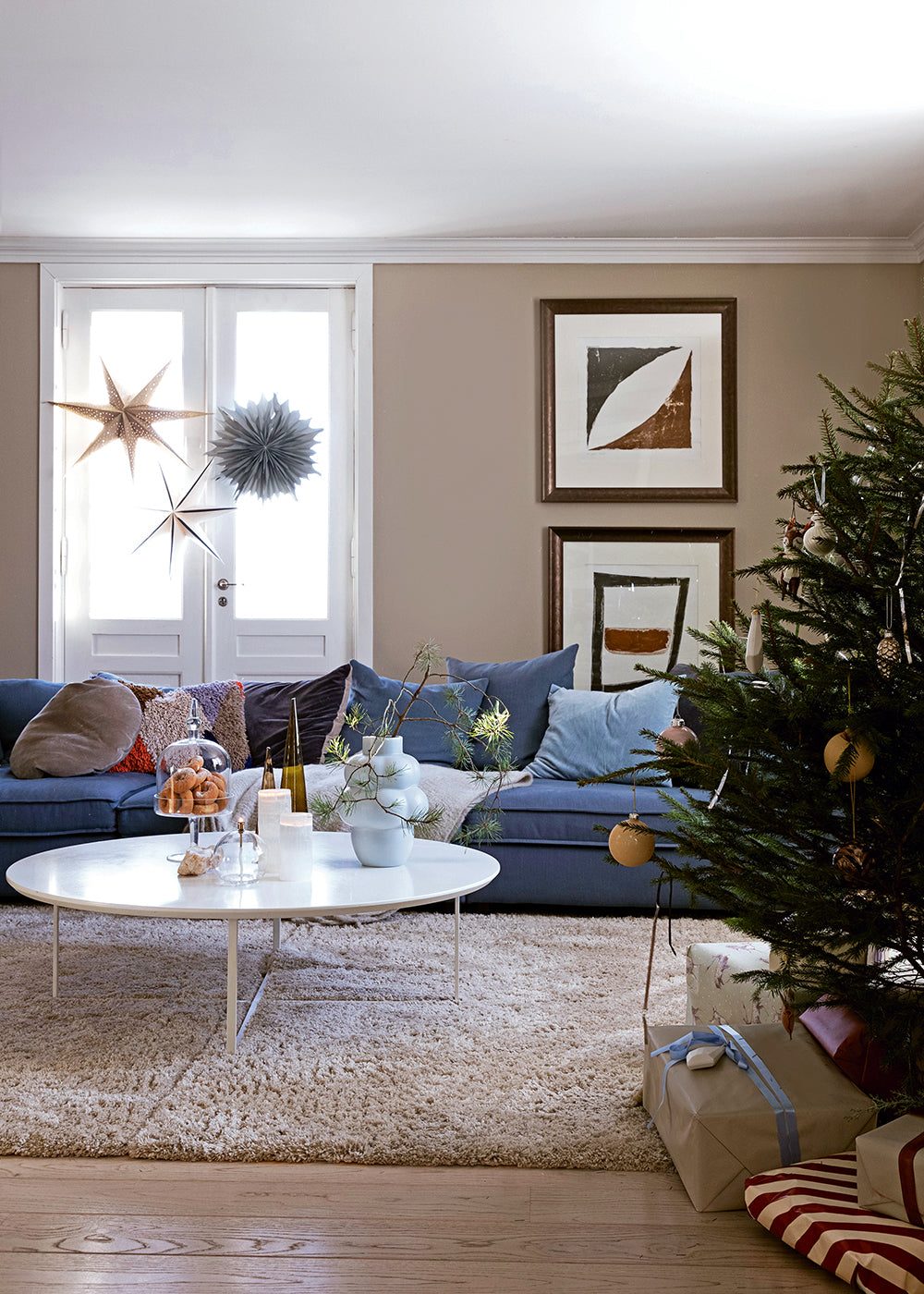 Scandi Living Room with Blue Sofa and Tree — Christmas Apartment Decor