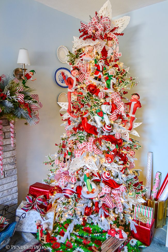Abundant Red and White Ribbons on a Whimsical Flocked Tree Abundant Red and White Ribbons on a Whimsical Flocked Tree — Whimsical Christmas Decor