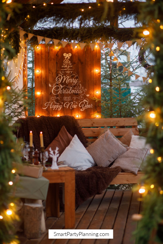 Rustic Wooden Sign and String Lights for an Outdoor Christmas Patio — Christmas Party Decor