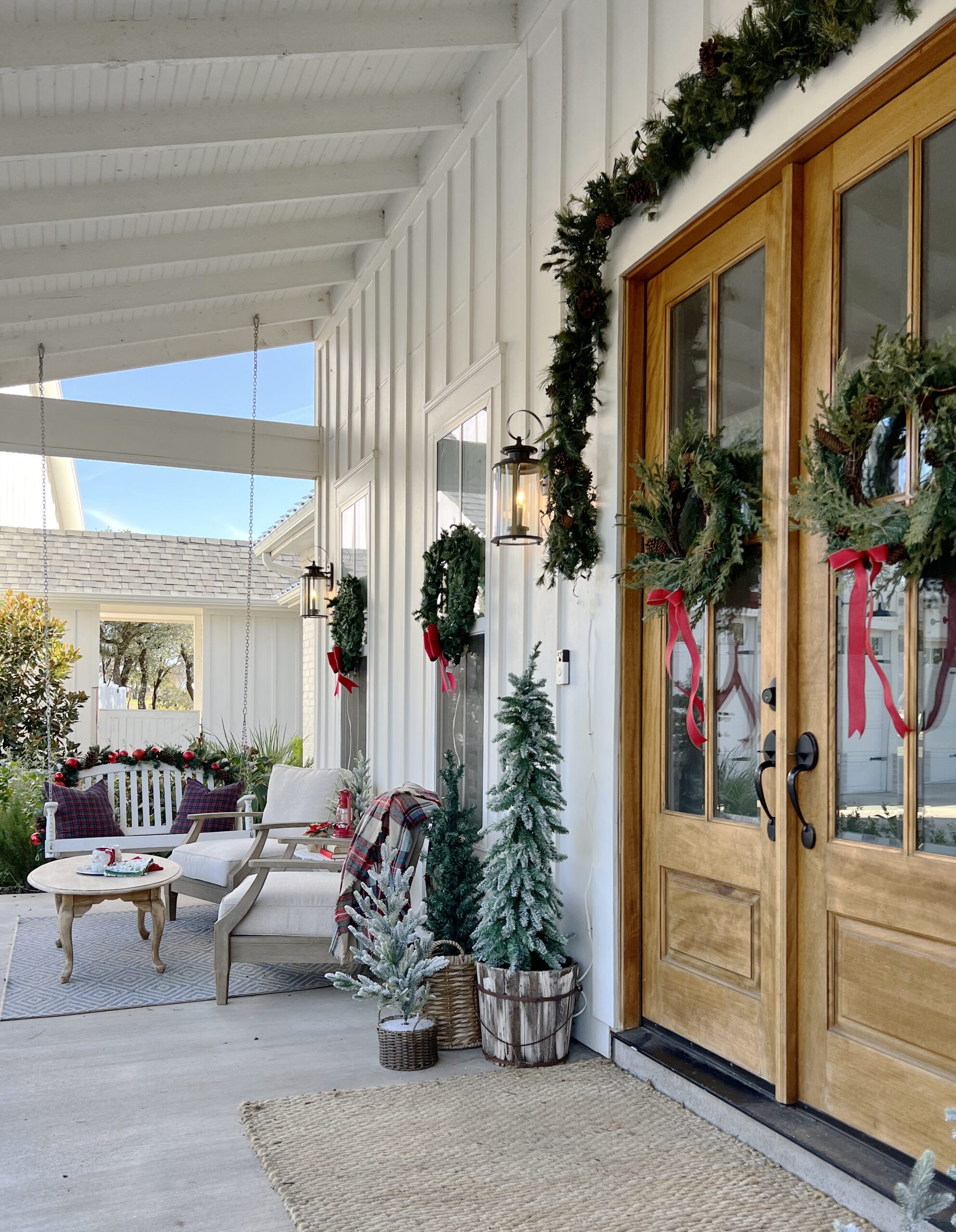 Wide View Of Porch Entrance Spacious Farmhouse Porch with Double Doors and Porch Swing — Farmhouse Christmas Porch