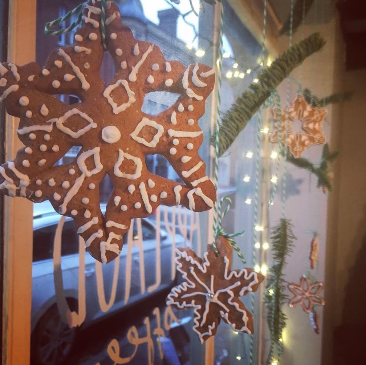 Handmade Gingerbread Snowflake Ornaments and String Lights — Christmas Window Decor Outdoor