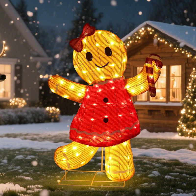 Whimsical Illuminated Gingerbread Woman on the Lawn Whimsical Illuminated Gingerbread Woman on the Lawn — Christmas Light Display Ideas