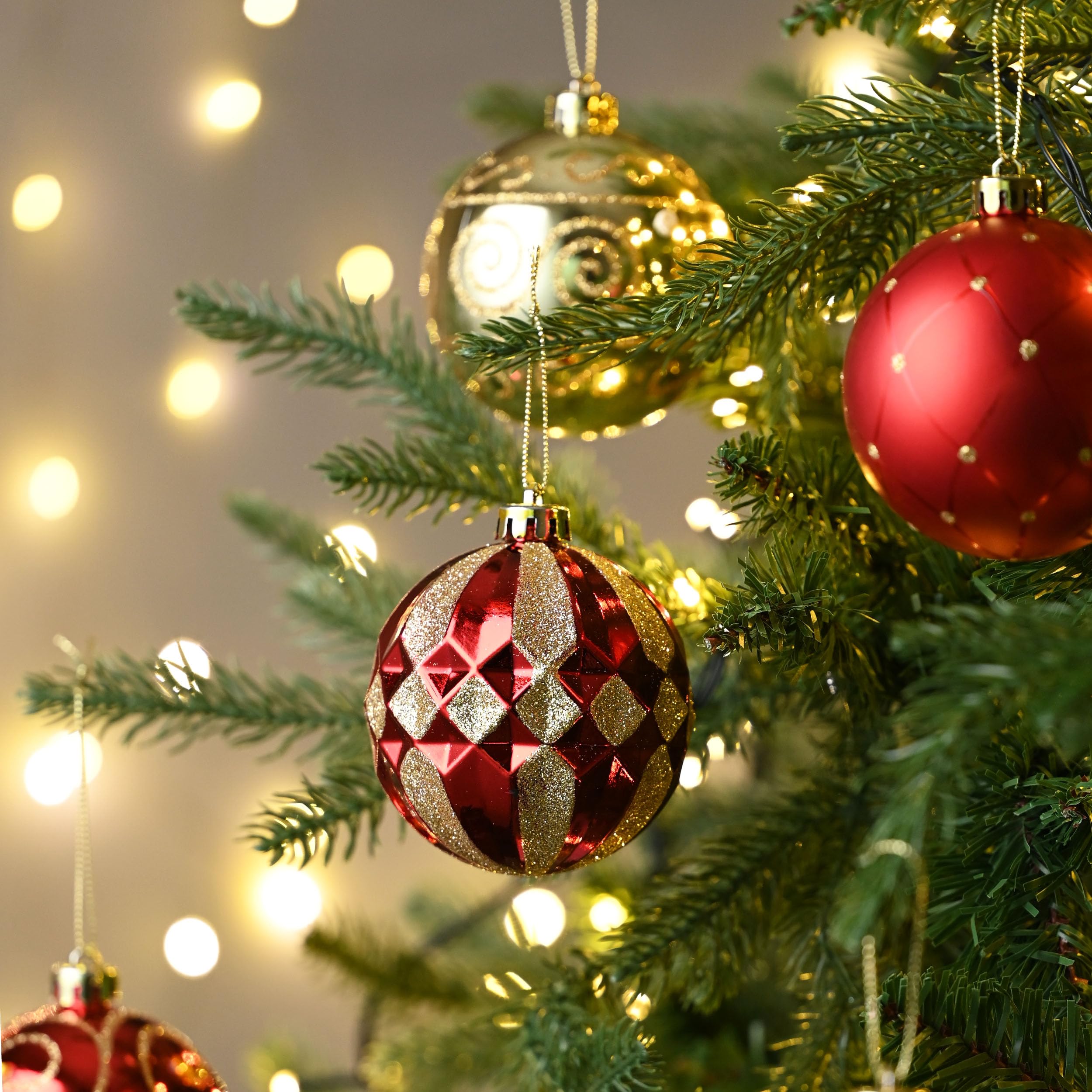 Close-Up of Ornate Red and Gold Baubles with Bokeh — Red and Gold Christmas Tree