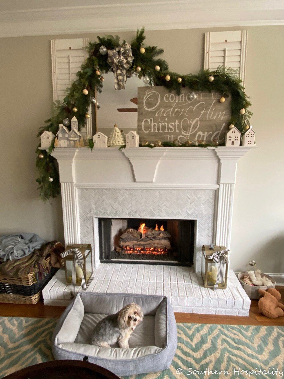 White Farmhouse Mantel with Miniature Houses and Dog Bed White Farmhouse Mantel with Miniature Houses and Dog Bed — Farmhouse Christmas Mantel