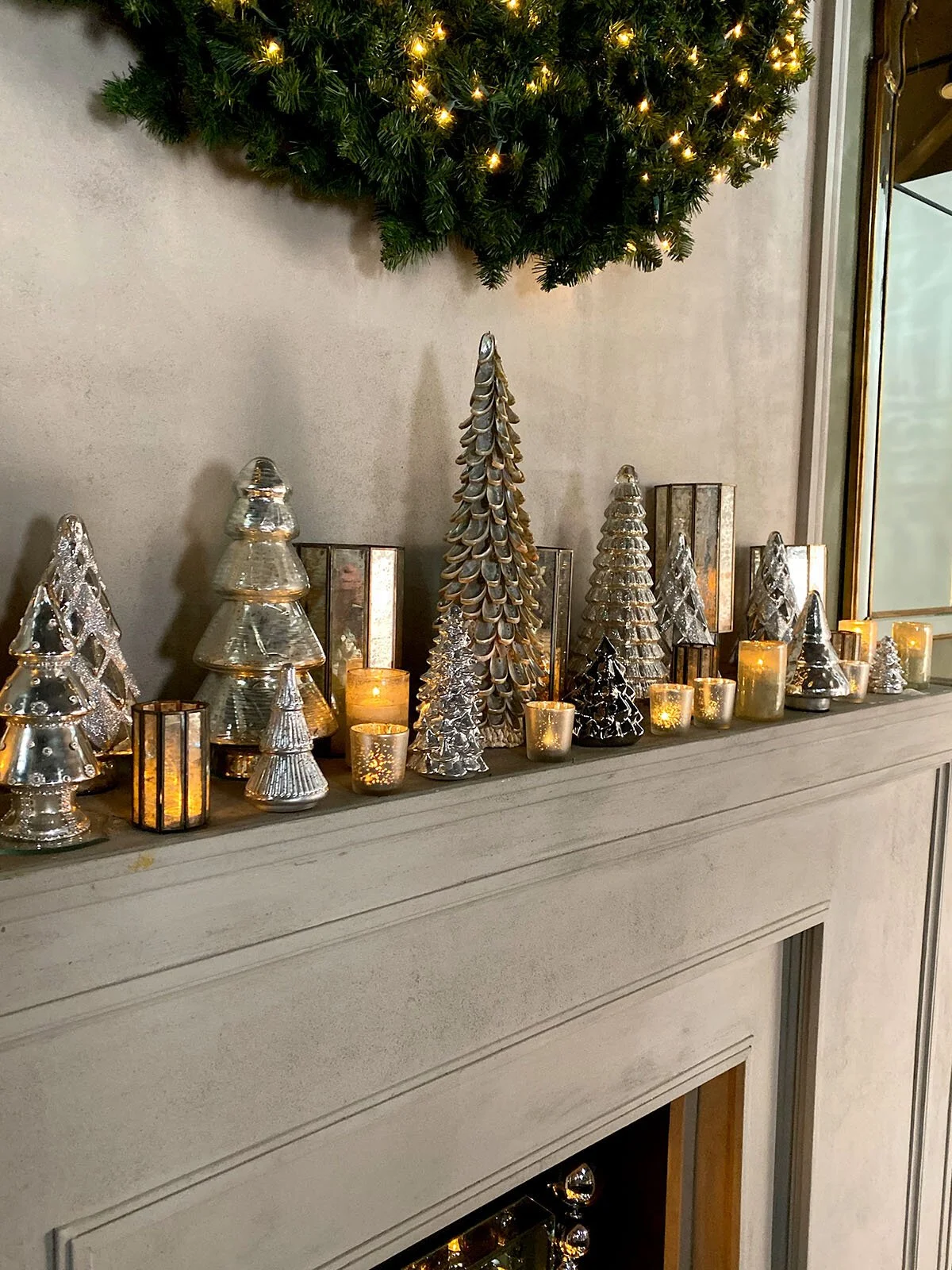 Minimalist Mantel Featuring a Sparkling Mercury Glass Tree Collection — Christmas Mantel Decor