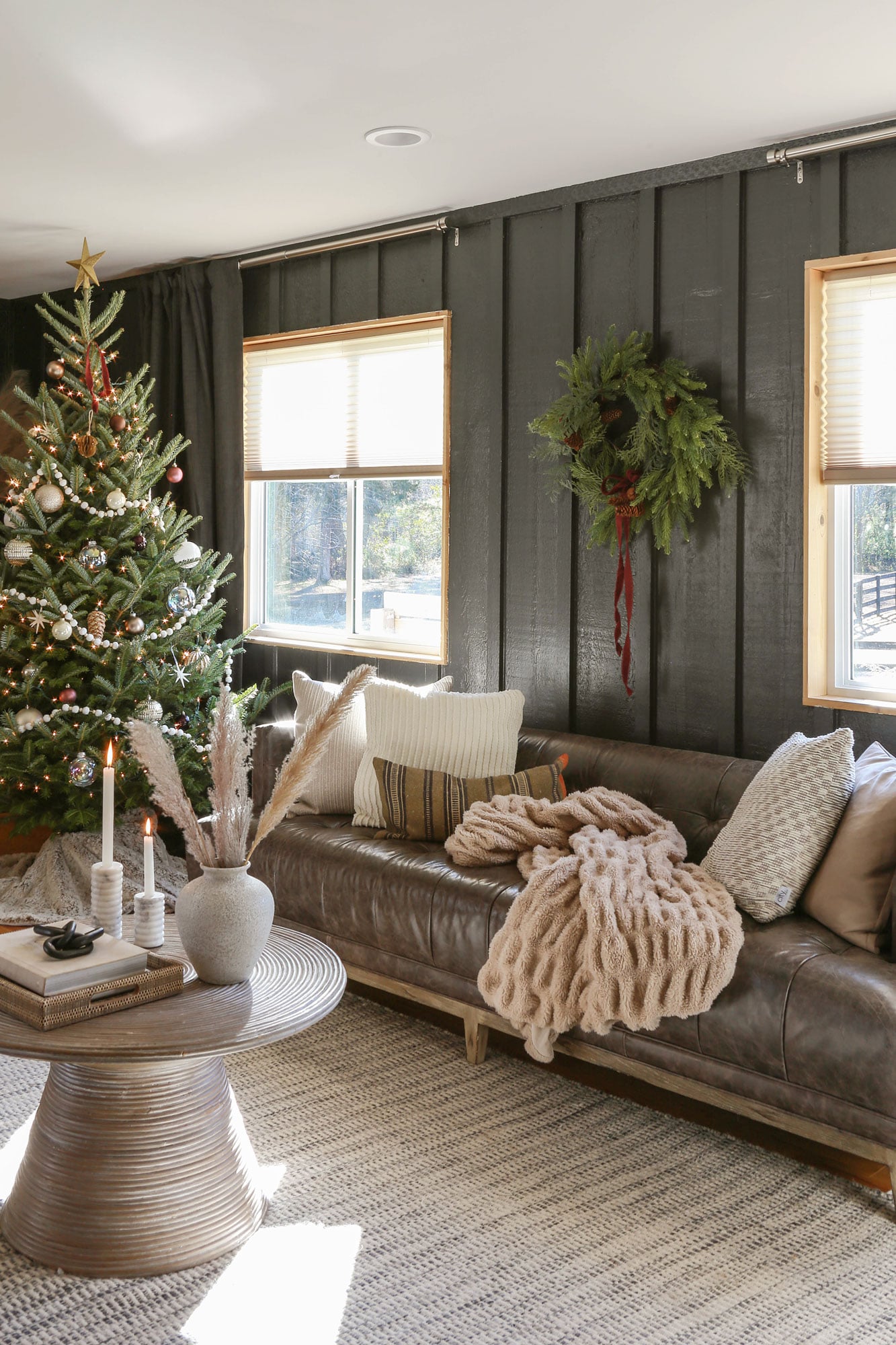 Moody Modern Living Room with Dark Paneling and Christmas Tree — Modern Christmas Decor