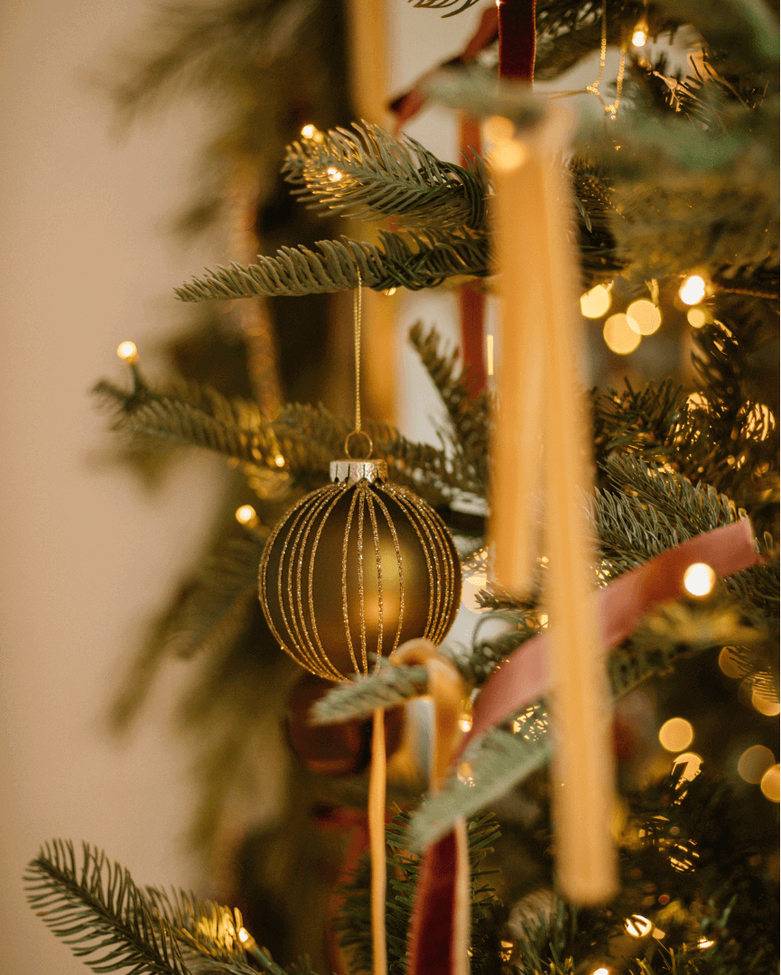 Elegant Gold Bauble on a Christmas Tree Branch — Vintage Christmas Decor