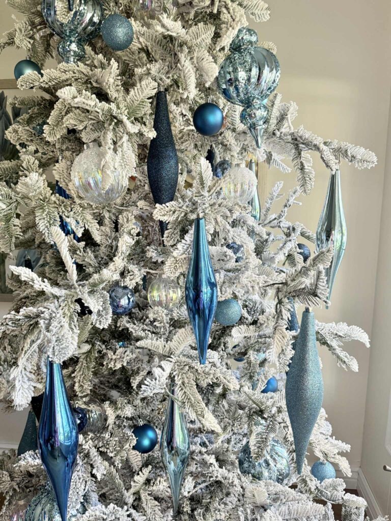 Modern Flocked Tree with Striking Blue and Silver Ornaments — Flocked Christmas Tree Decor