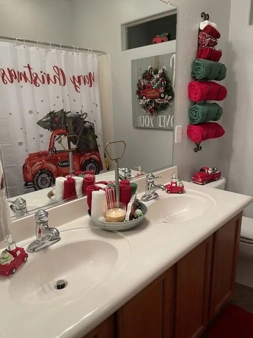 Red Truck Themed Bathroom Decor and Rolled Towels — Christmas Bathroom Decor