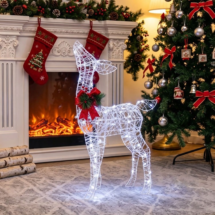 Illuminated Reindeer Decoration Adds Festive Charm by the Fireplace — Christmas Lights Indoor
