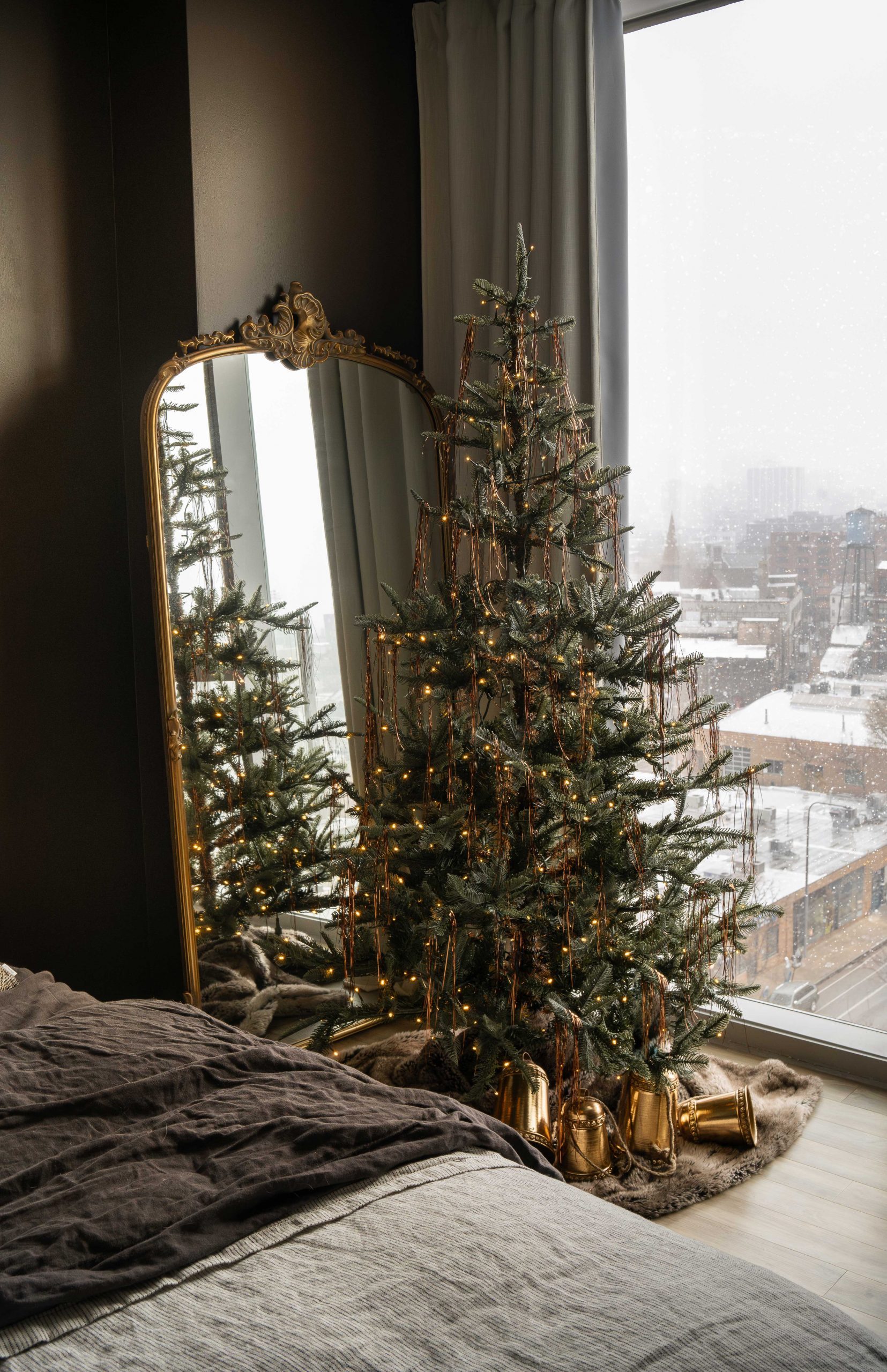 Bedroom Tree Reflected in Ornate Gold Mirror with Snowy View — Minimalist Christmas Tree