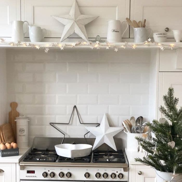 Modern Farmhouse Shelf Accented with White Stars and Lights Modern Farmhouse Shelf Accented with White Stars and Lights — Christmas Kitchen Decor