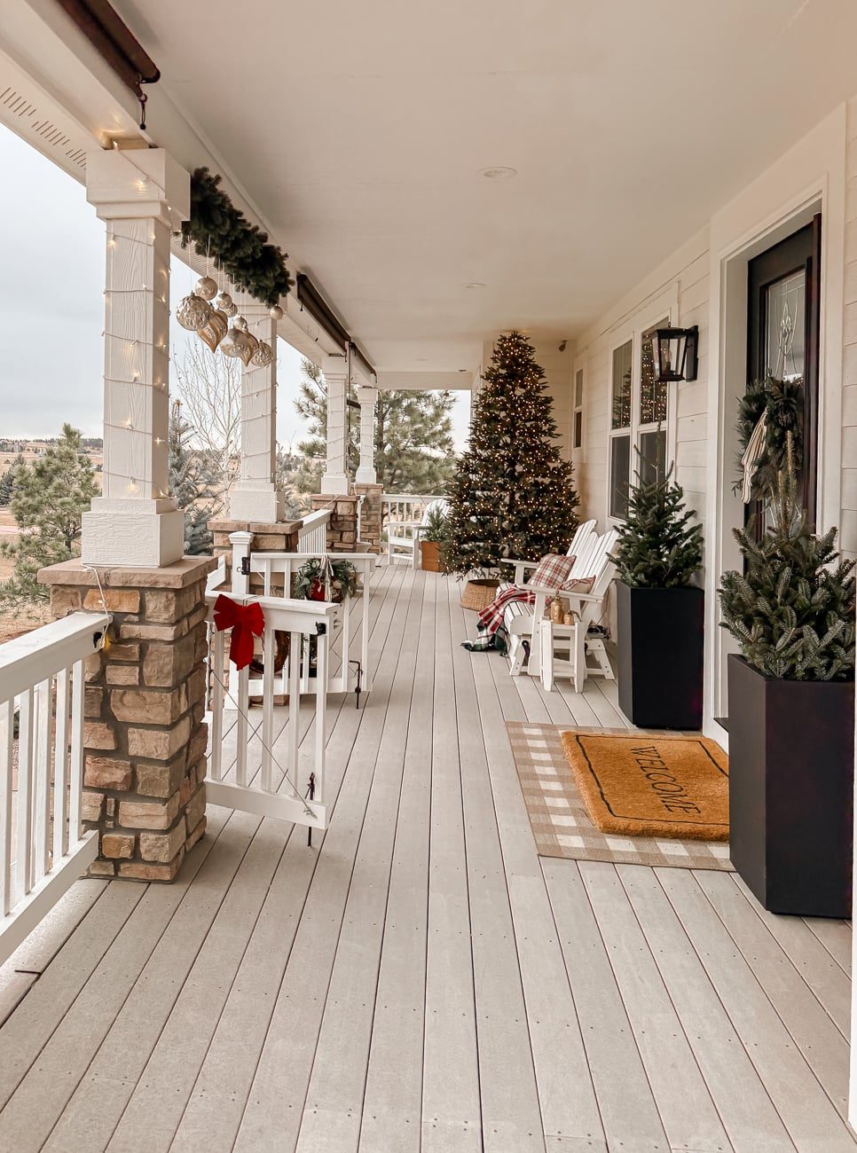 Farmhouse Porch with Large Christmas Tree and White Chairs — Farmhouse Christmas Porch