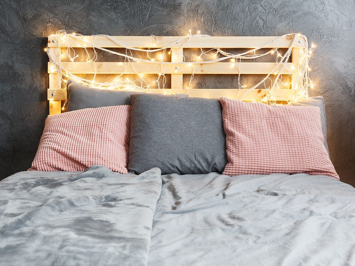 Modern Rustic Bedroom with Pallet Wood Headboard and Fairy Lights — Christmas Fairy Lights Headboard
