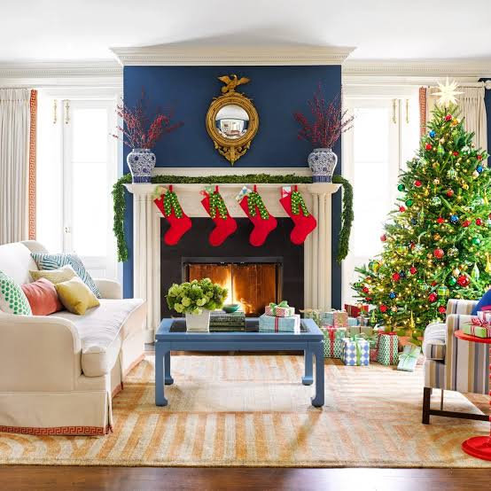 Traditional Fireplace with Red Stockings and Blue Sofa Traditional Fireplace with Red Stockings and Blue Sofa — Christmas Fireplace Decor