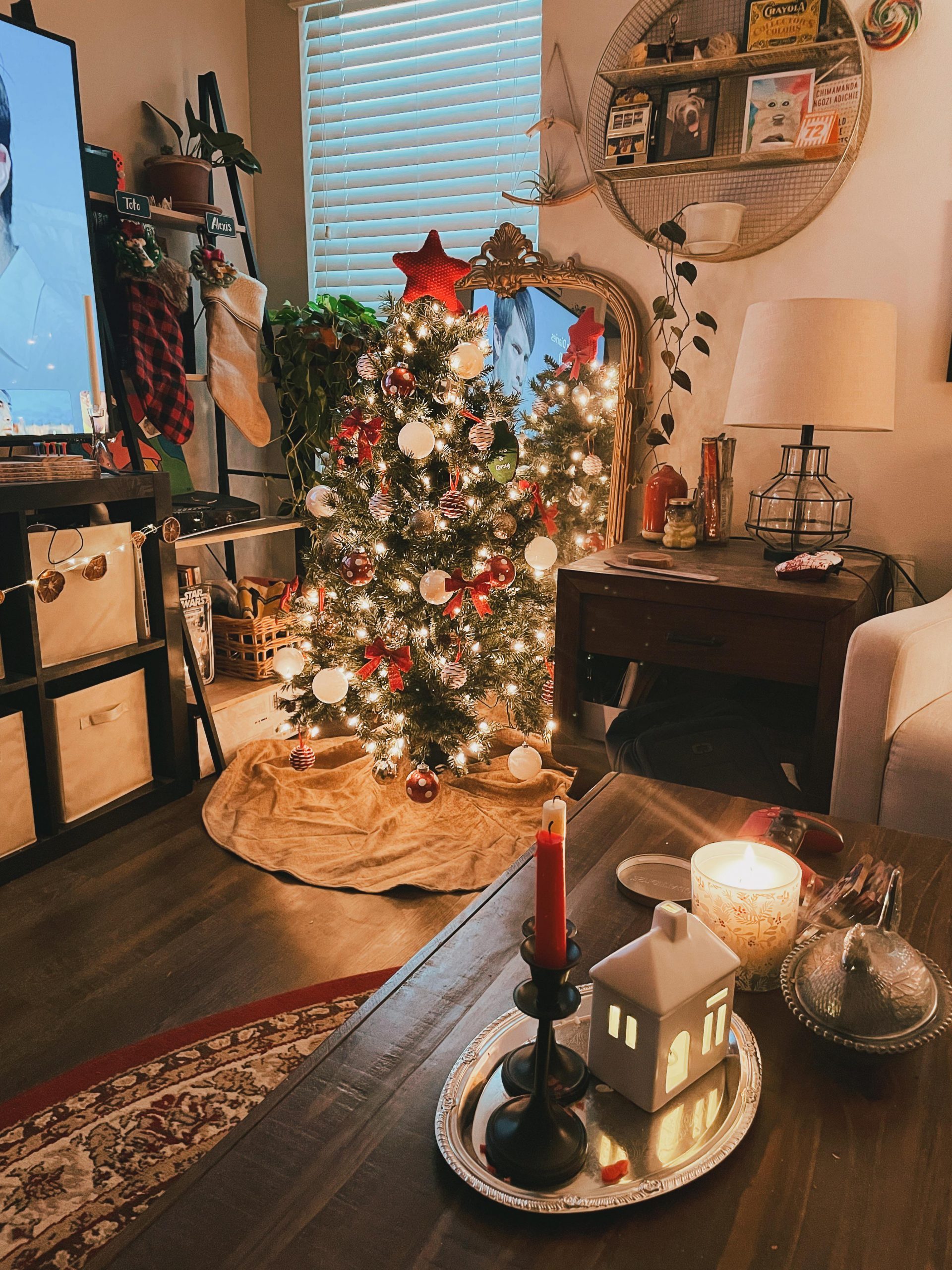 Eclectic Tree with Red Bows and Warm Light — Christmas Apartment Decor