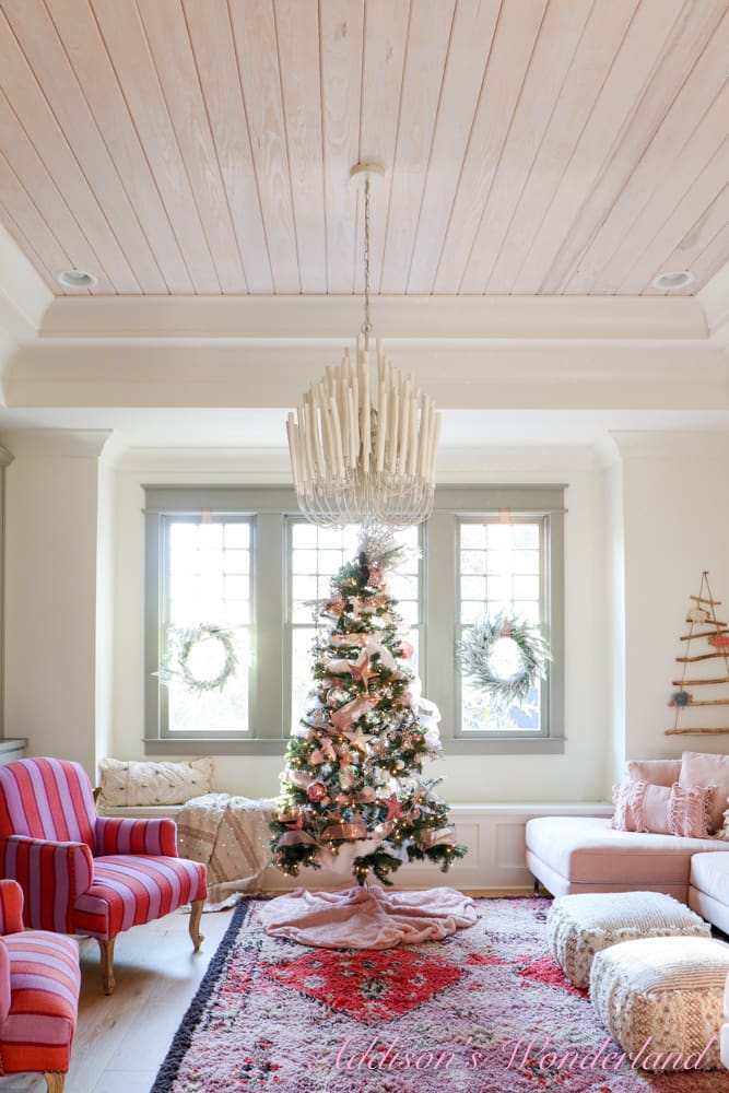 Whimsical Pink and White Christmas Tree in Cozy Seating Area — Winter Wonderland Christmas Decor
