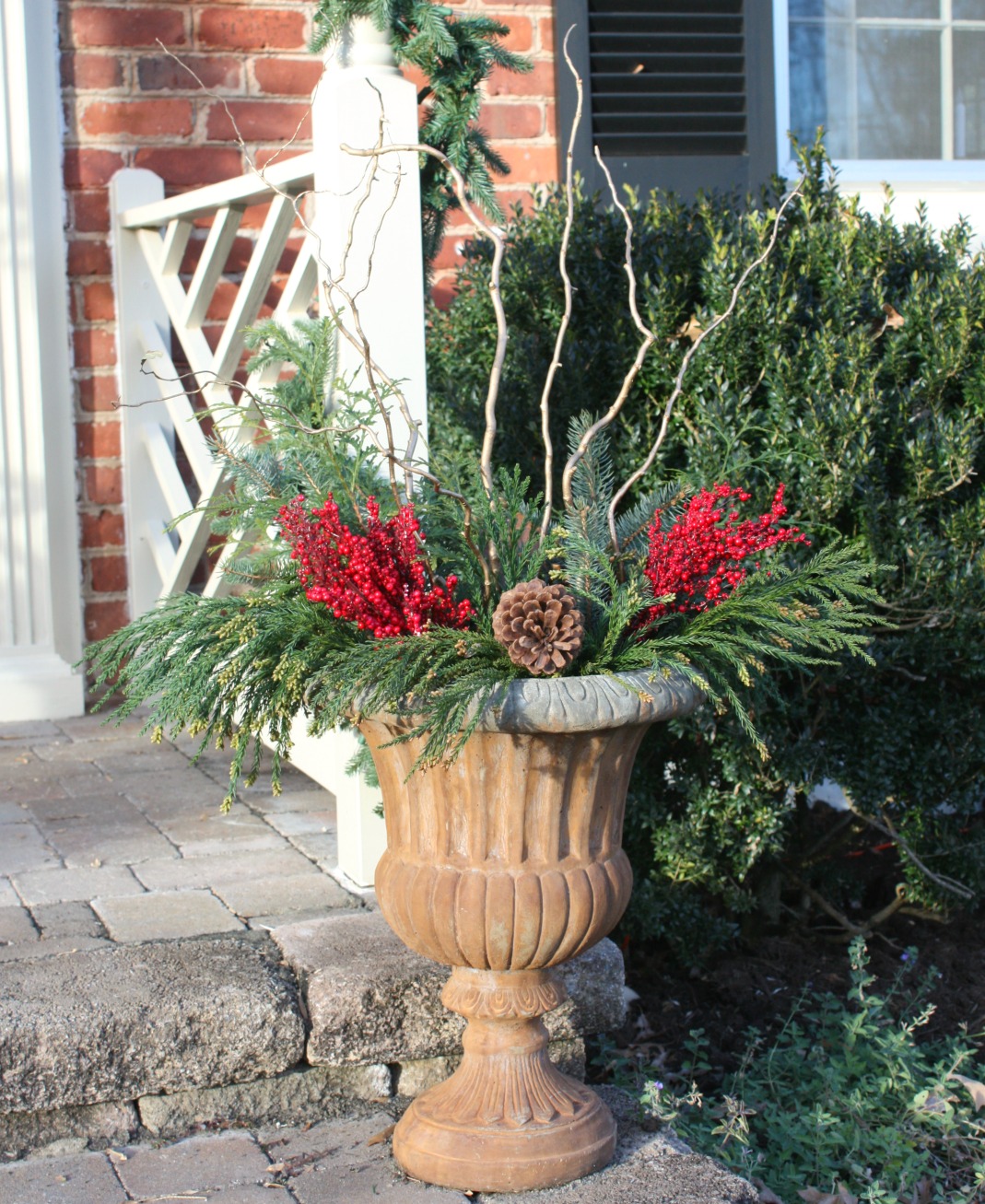 Traditional Stone Urn with Birch Sticks and Pinecones Traditional Stone Urn with Birch Sticks and Pinecones — Christmas Porch Planters
