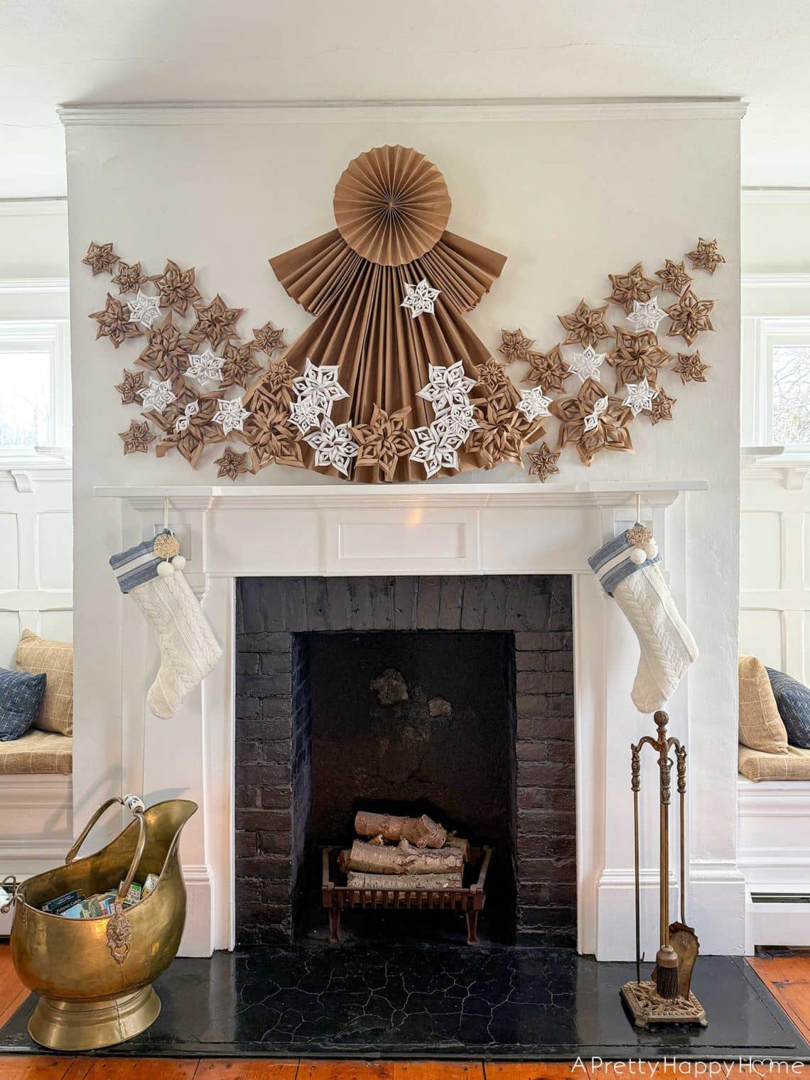 Handmade Rustic Mantel with Large Paper Angel and Knit Stockings — Christmas Mantel Decor