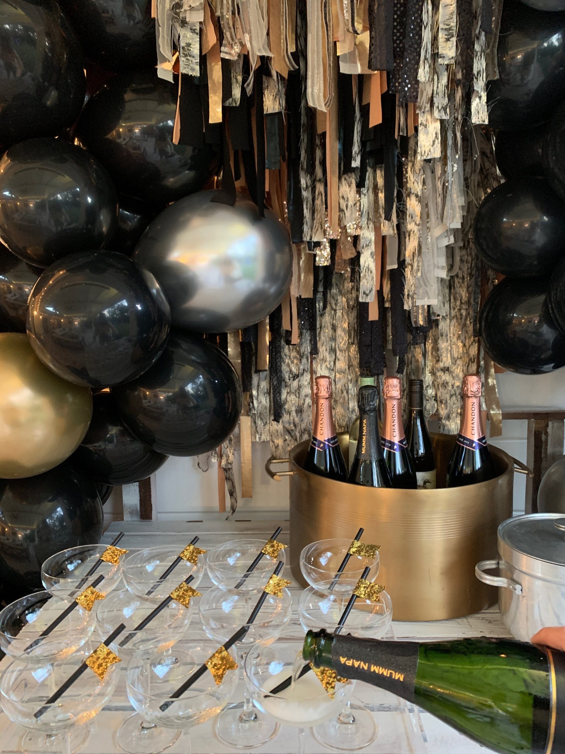 Glamorous Bar Setup with Metallic Fringe Backdrop Glamorous Bar Setup with Metallic Fringe Backdrop — New Years Eve Party 2027