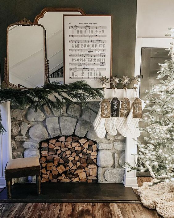 Stone Mantel with Pine Garland and Visible Firewood Stone Mantel with Pine Garland and Visible Firewood — Farmhouse Christmas Mantel