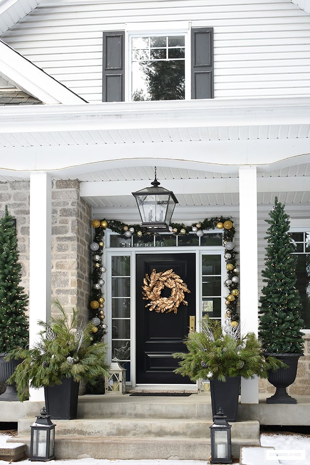 Welcoming Gold Wreath on a Black Front Door Welcoming Gold Wreath on a Black Front Door — Elegant Christmas Decor