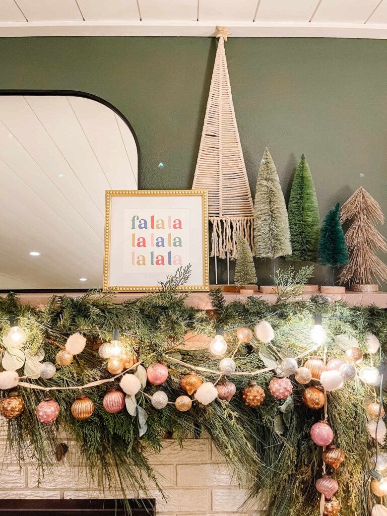 Whimsical Fireplace Mantel with 'Falala' Art and Trees Whimsical Fireplace Mantel with 'Falala' Art and Trees — Christmas Fireplace Decor