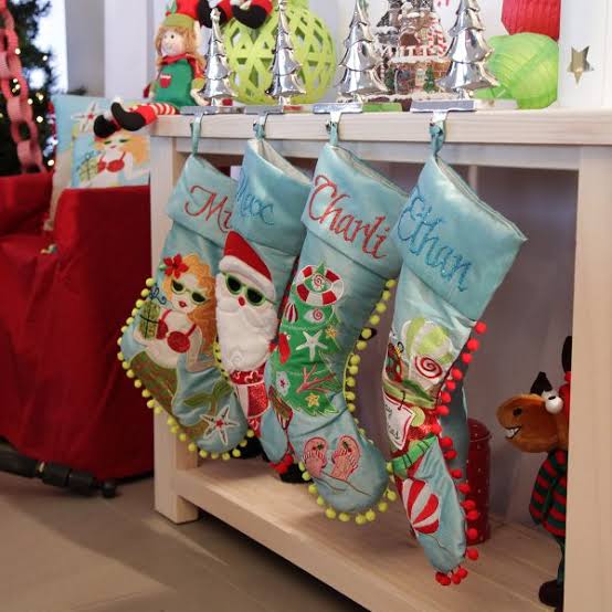 Whimsical Character Stockings on a Shelf — Christmas Stockings Display