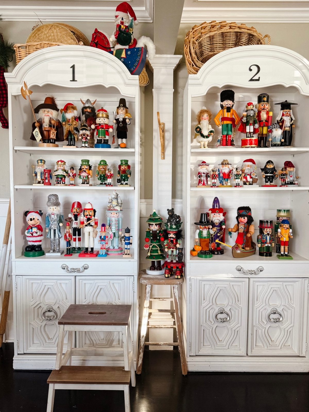 Comprehensive Nutcracker Display Within White Cabinets
