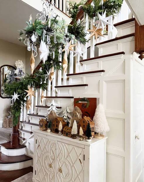 Garland with Paper Stars and Village Display Garland with Paper Stars and Village Display — Christmas Stair Garland