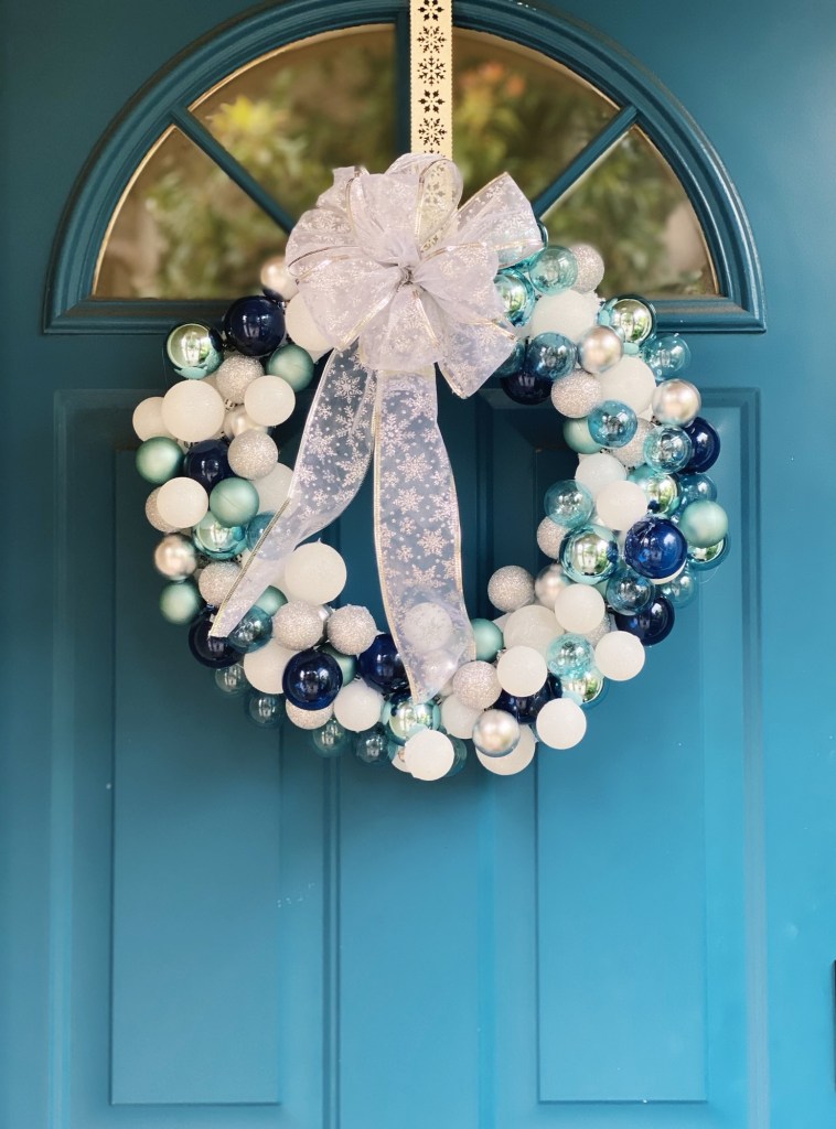 Striking Cool Tones: Blue and Silver Ornament Wreath with a Statement Bow Striking Cool Tones: Blue and Silver Ornament Wreath with a Statement Bow