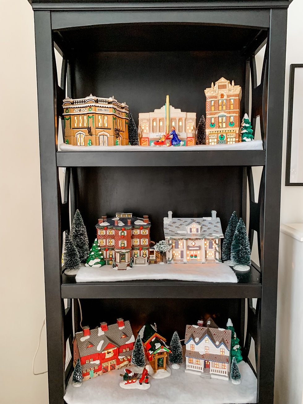 Organized Christmas Village on a Black Bookshelf — Christmas Village Display