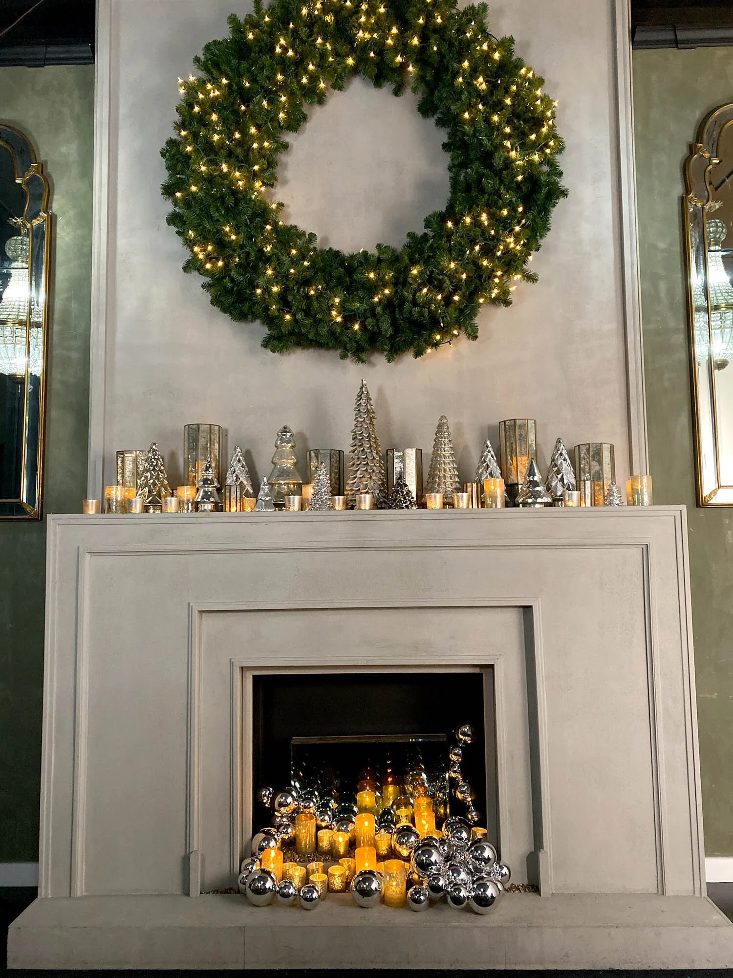Modern Gray Stone Mantel with Illuminated Wreath and Silver Trees — Christmas Mantel Decor