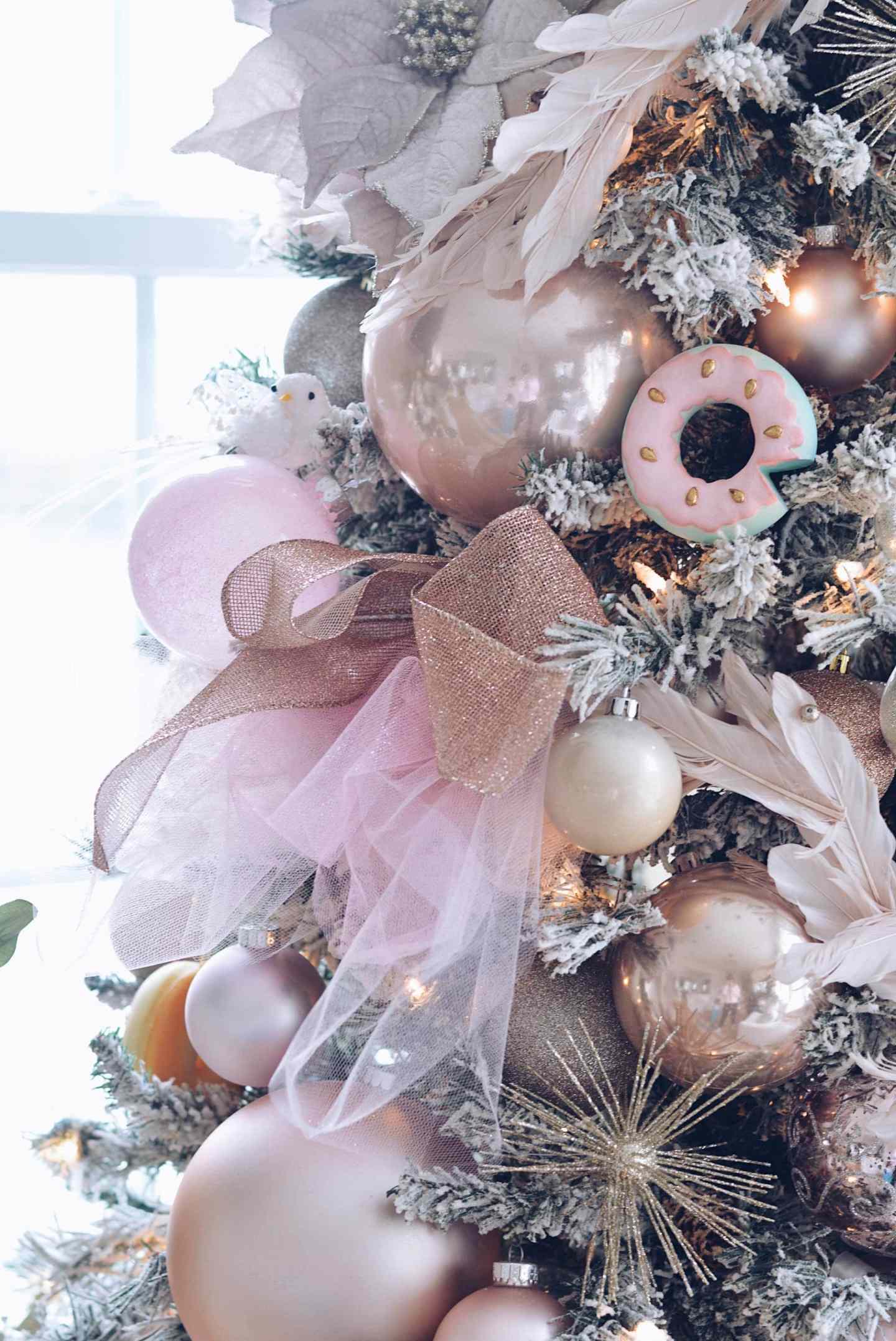 Whimsical Flocked Christmas Tree with Pink Donut and Rose Gold Ornaments Whimsical Flocked Christmas Tree with Pink Donut and Rose Gold Ornaments — Ornament Christmas Tree
