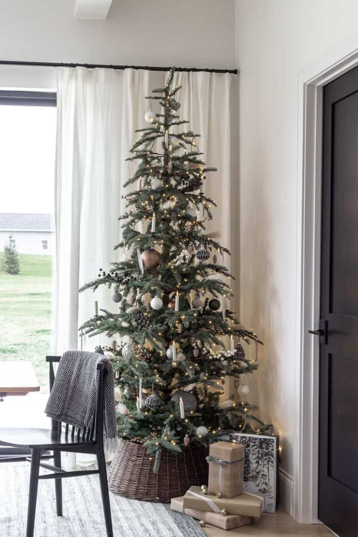 Tall, Slender Tree with Woven Skirt and Dark Accents — Minimalist Christmas Tree