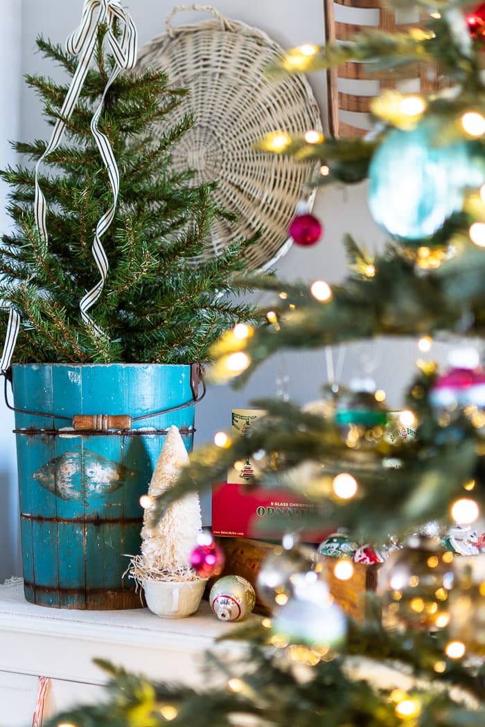 Miniature Christmas Tree in a Teal Bucket on a Mantel — Vintage Christmas Decor