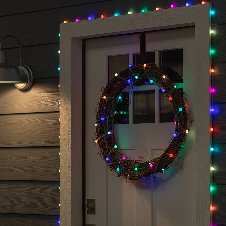 Multicolor Lights Framing an Indoor Doorway — Christmas Door Frame Lights
