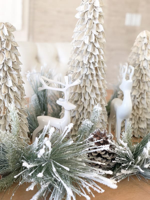 Neutral Whimsical Vignette with Flocked Trees and Ceramic Deer Neutral Whimsical Vignette with Flocked Trees and Ceramic Deer — Whimsical Christmas Decor