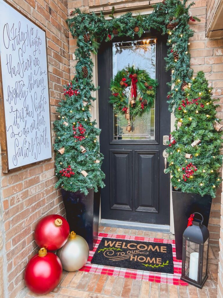 Traditional Doorway with Flanking Christmas Trees, Garland, and Ornaments — Simple Christmas Outdoor Decor
