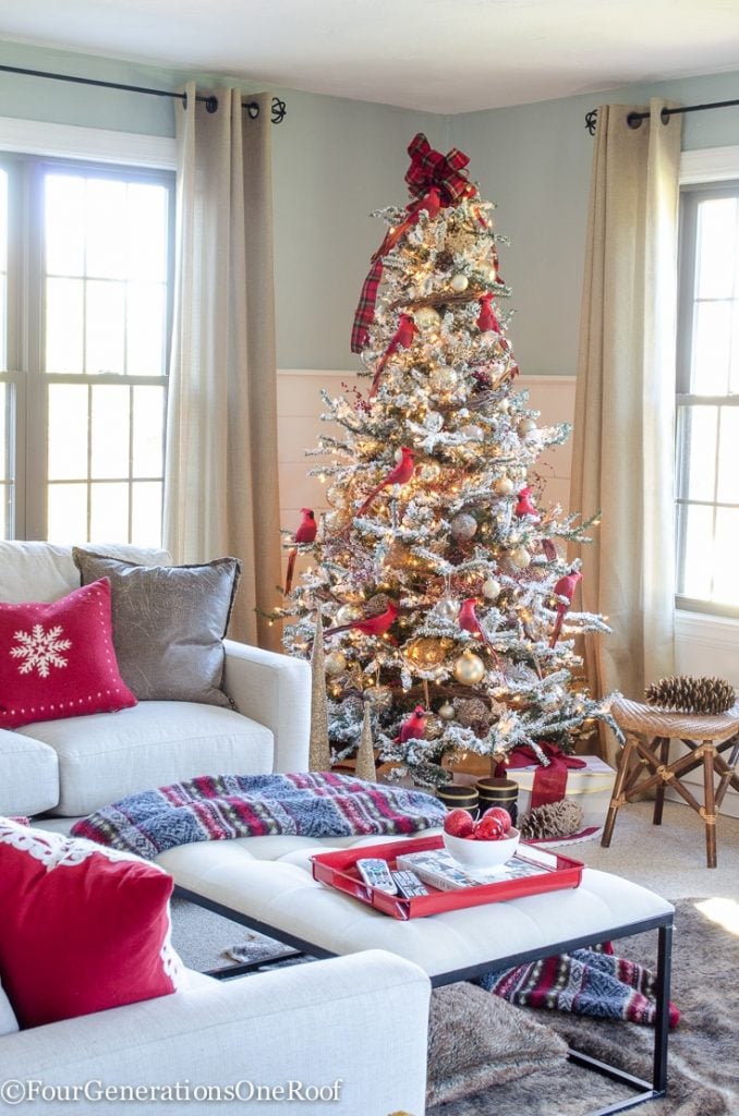 Cozy Living Room with a Flocked Christmas Tree Featuring Cardinal Ornaments Cozy Living Room with a Flocked Christmas Tree Featuring Cardinal Ornaments — Red and White Christmas Tree