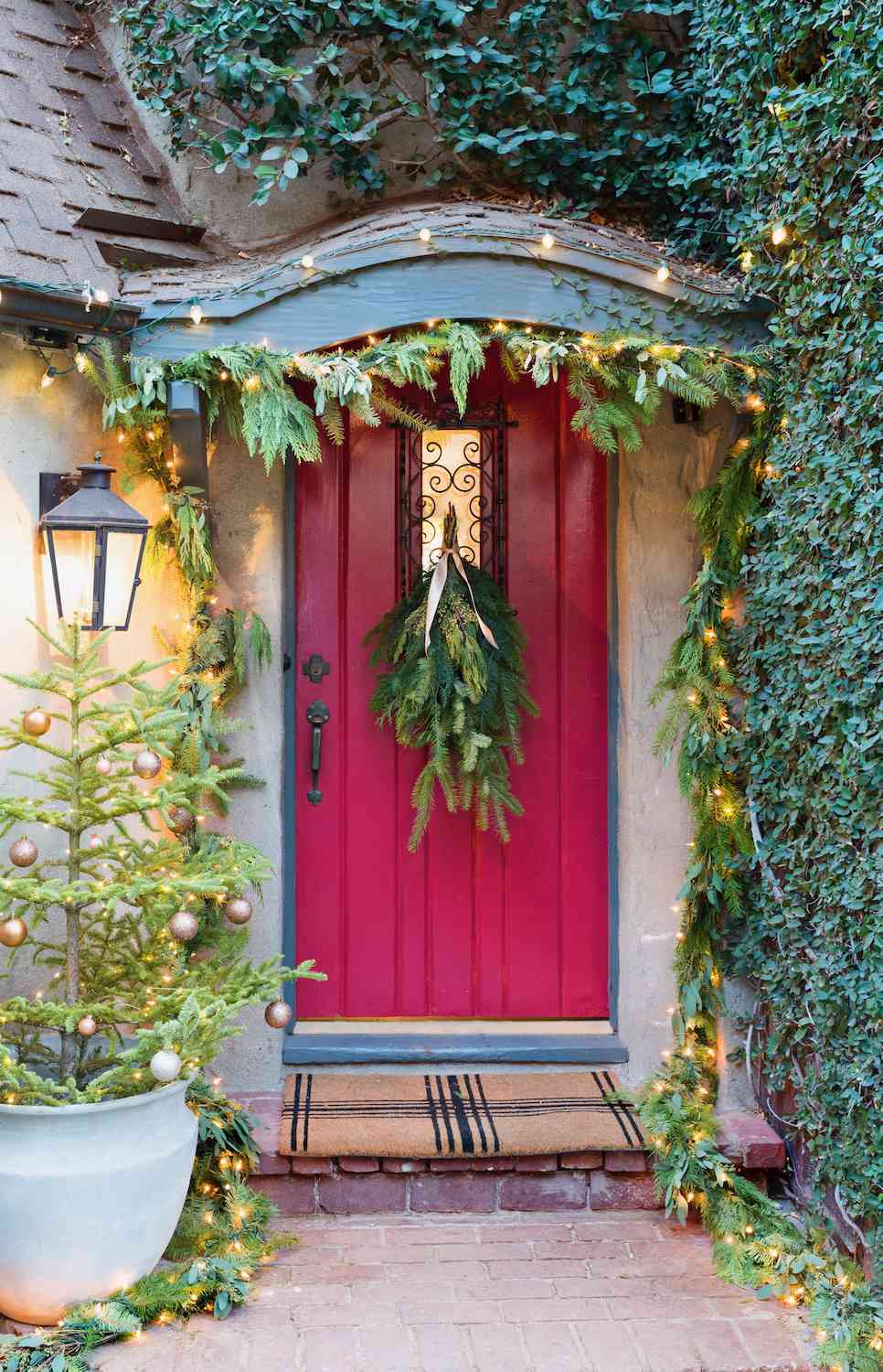 Charming Red Door with Greenery Garland and Twinkling Lights — Christmas House Exterior Decor