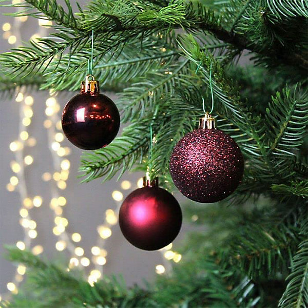 Varied Burgundy Christmas Baubles on a Tree Branch Varied Burgundy Christmas Baubles on a Tree Branch — Burgundy Christmas Decor