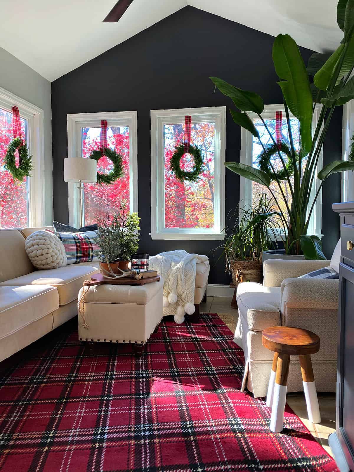 Sunroom Wreaths Complementing a Plaid Rug — Christmas Window Wreaths
