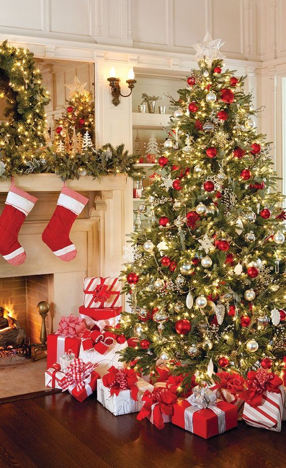 Festive Living Room with Red and White Stockings and a Decorated Tree Festive Living Room with Red and White Stockings and a Decorated Tree — Red and Gold Christmas Decor