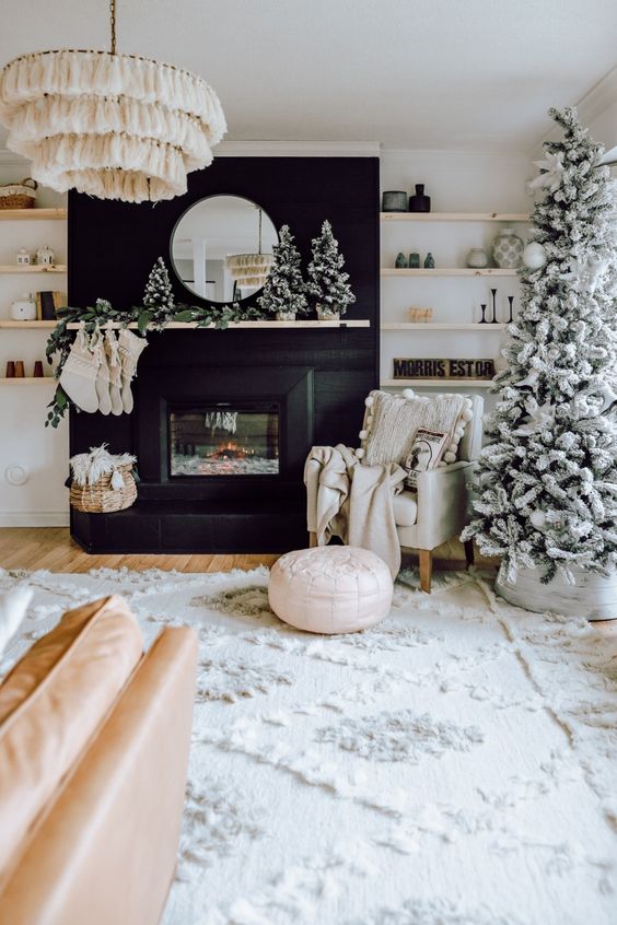 Bold Modern Fireplace with Flocked Christmas Tree and Black Accents — Modern Christmas Decor