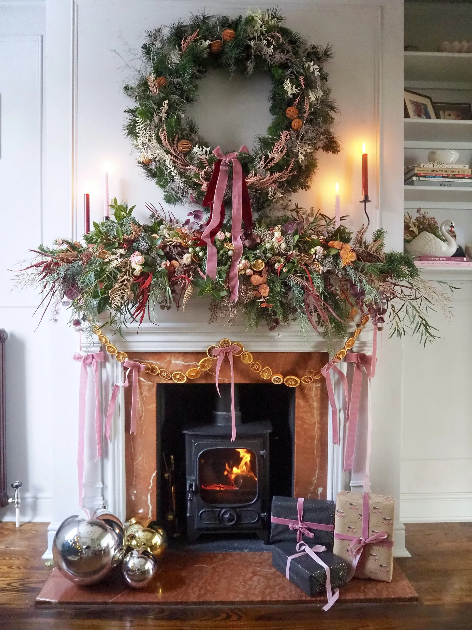 Cozy Traditional Mantel with Greenery and Pink Ribbons Cozy Traditional Mantel with Greenery and Pink Ribbons — Simple Christmas Decor