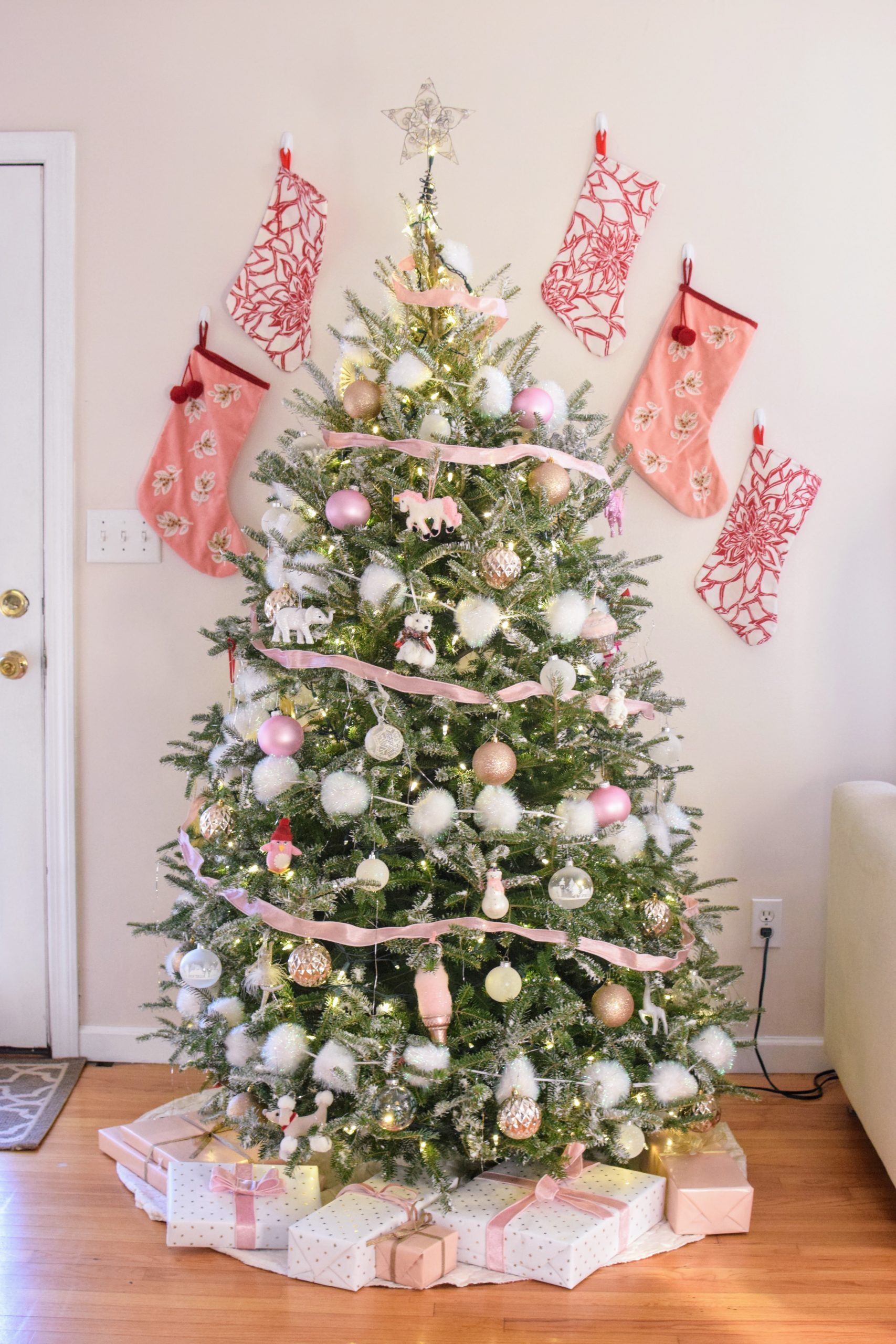 Traditional Living Room with Pink Stockings and a Star-Topped Tree Traditional Living Room with Pink Stockings and a Star-Topped Tree — Pink Christmas Decor