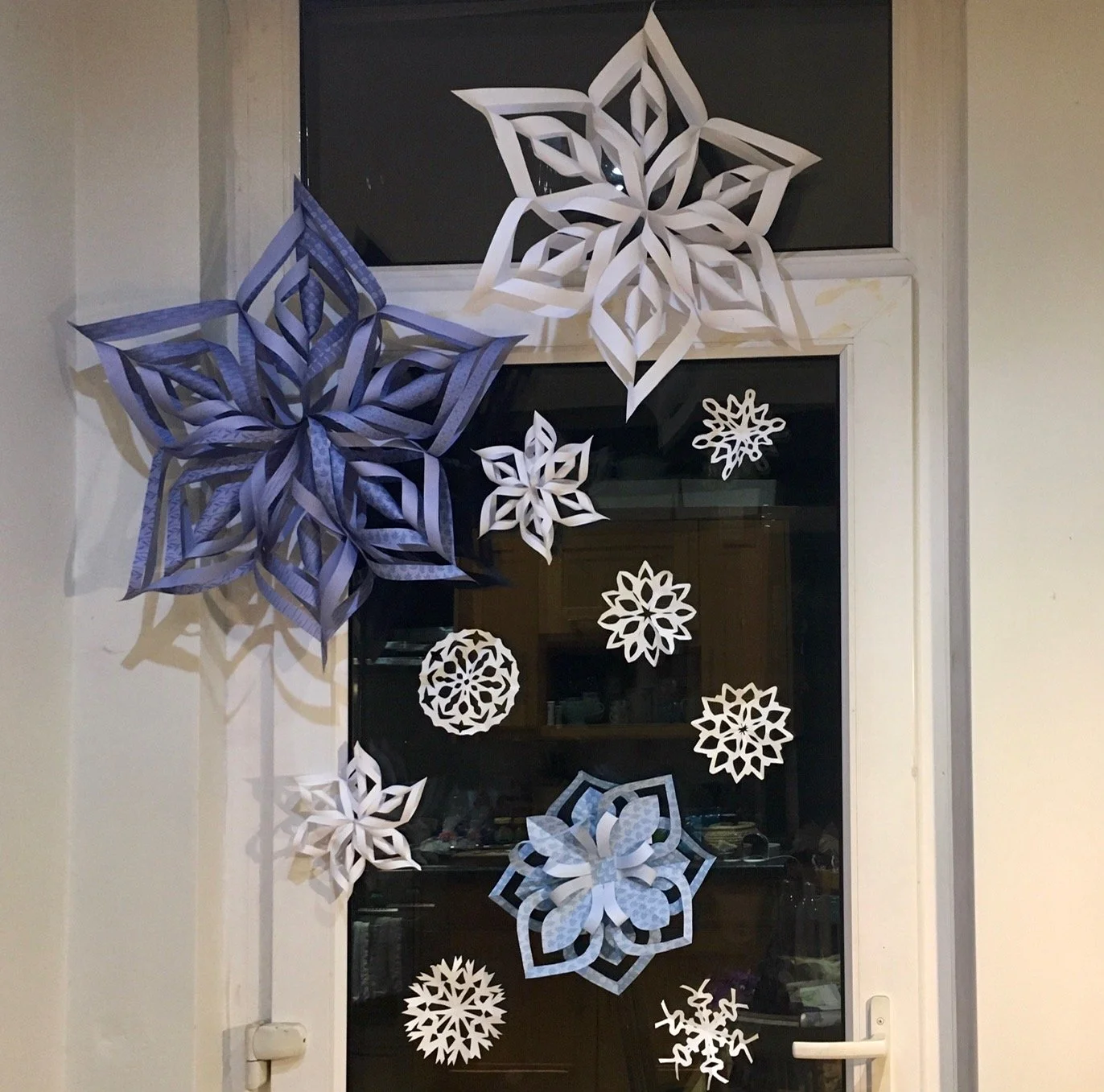 Eclectic Doorway Adorned With Varied Paper Snowflakes