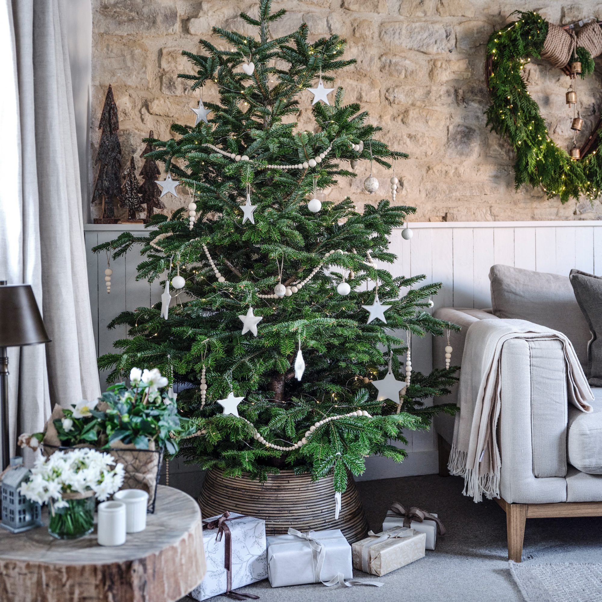 Scandinavian Tree Adorned with Natural Wood Beads and White Stars Scandinavian Tree Adorned with Natural Wood Beads and White Stars — Scandinavian Christmas Tree